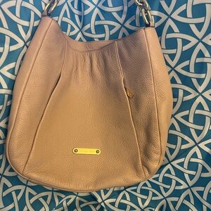 Michael Kors tan lightly used hand. Great condition.